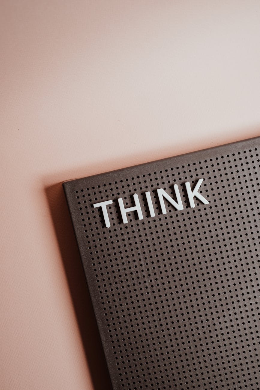 the word think on a pin board